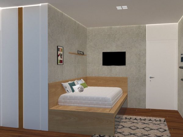 A cama que ocupa toda a parede conta com baús laterais